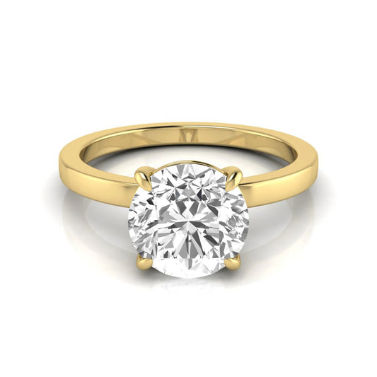 Round solitaire lab grown diamond engagement ring featuring a 2.07 carat IGI certified round brilliant diamond in a classic four-prong setting in yellow gold
