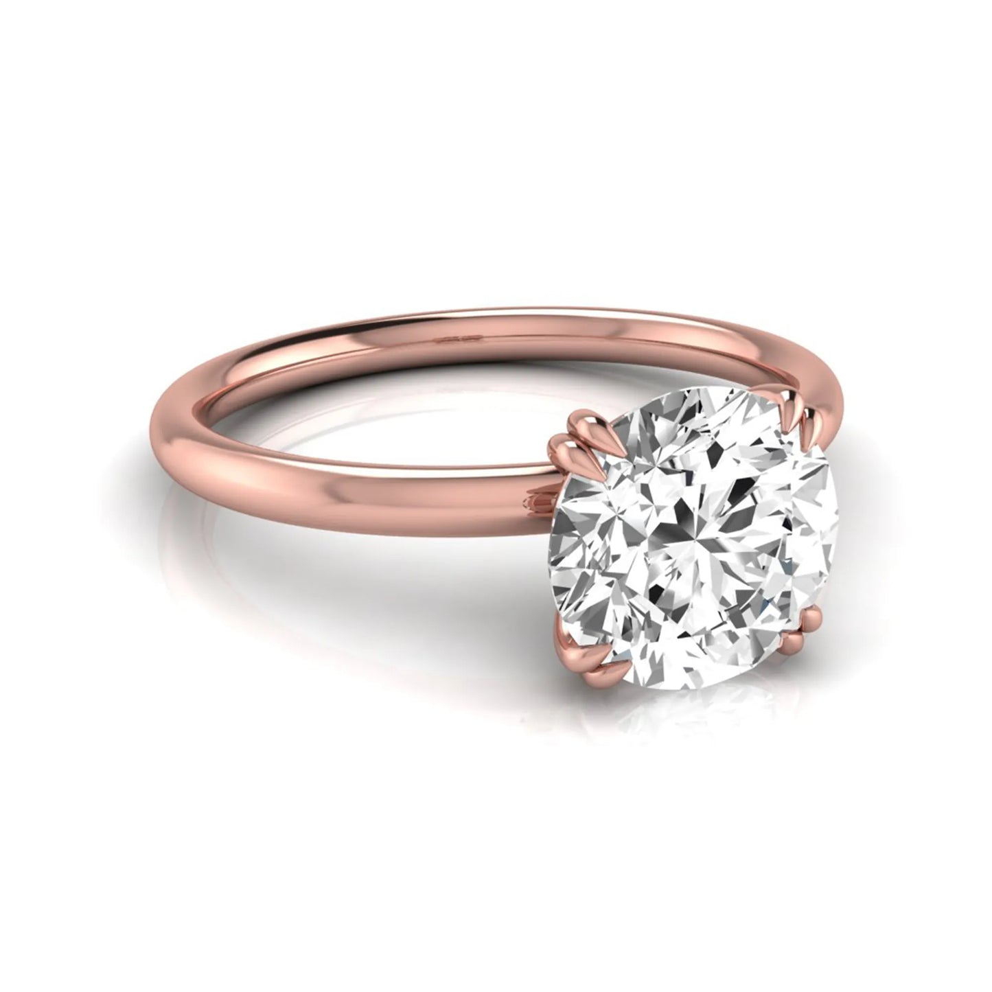 Round cut lab grown diamond solitaire engagement ring with six-prong setting in rose gold style.