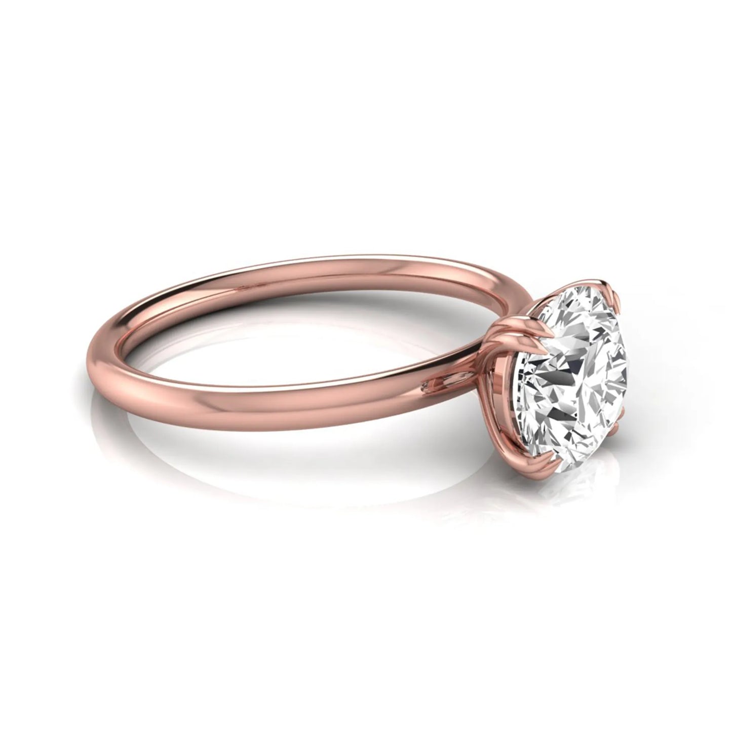 Round cut lab grown diamond solitaire engagement ring with six-prong setting in rose gold style.