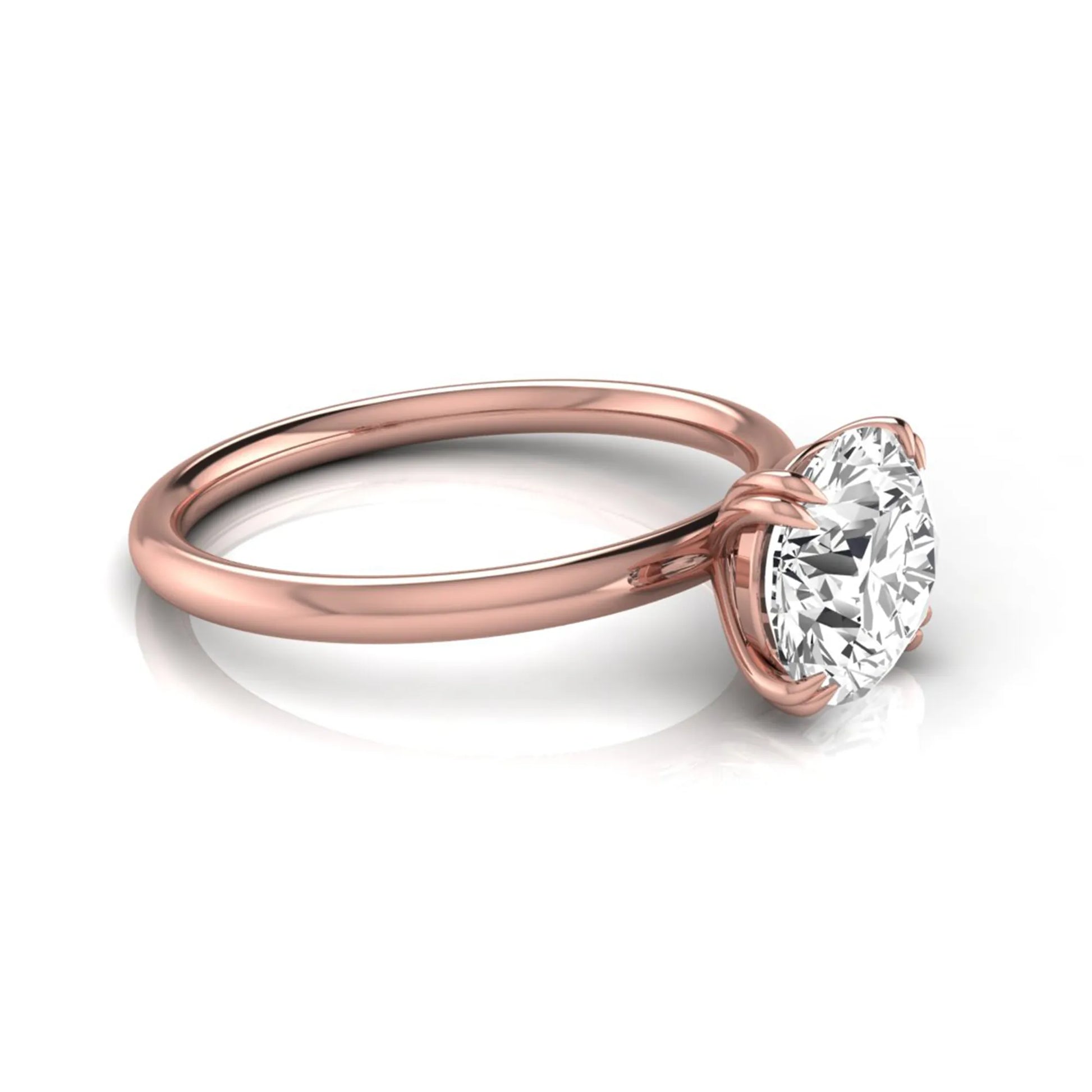 Round cut lab grown diamond solitaire engagement ring with six-prong setting in rose gold style.