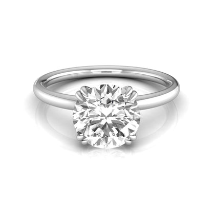 Round cut lab grown diamond solitaire engagement ring with six-prong setting in white gold style.