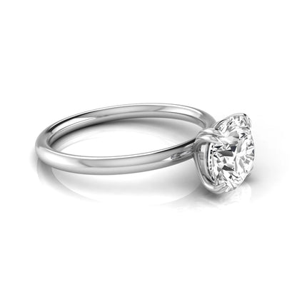 Round cut lab grown diamond solitaire engagement ring with six-prong setting in white gold style.