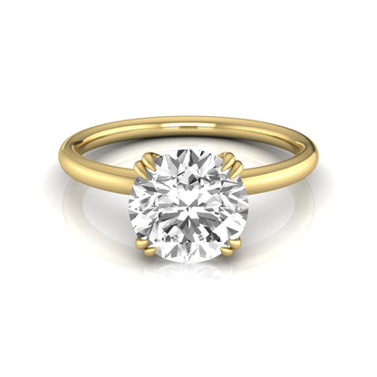 Round cut lab grown diamond solitaire engagement ring with six-prong setting in yellow gold style.