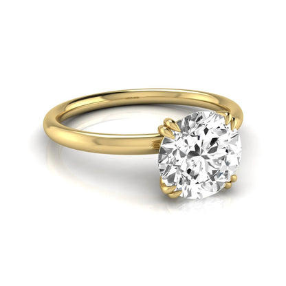 Round cut lab grown diamond solitaire engagement ring with six-prong setting in yellow gold style.
