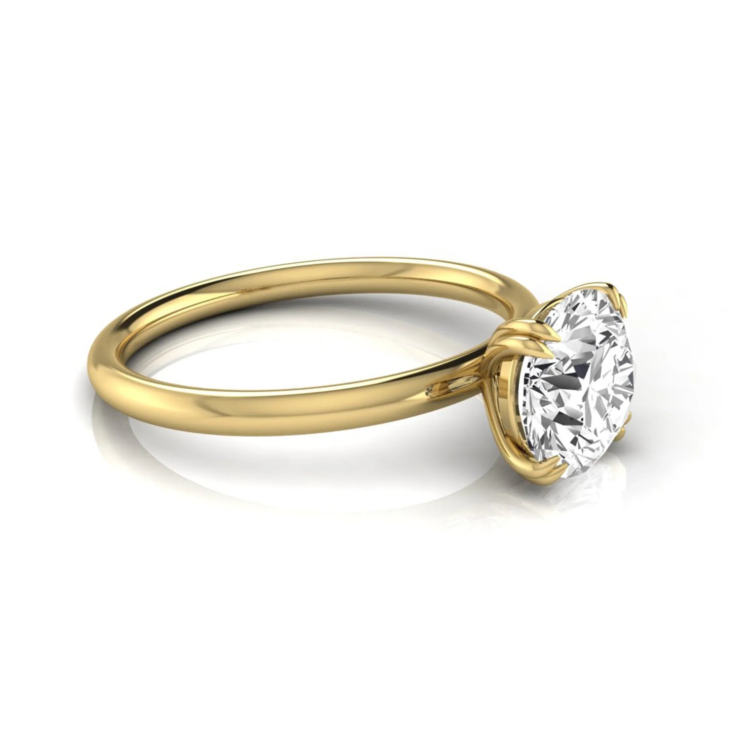 Round cut lab grown diamond solitaire engagement ring with six-prong setting in yellow gold style.