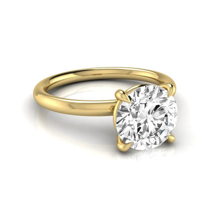 Round cut lab grown diamond engagement ring featuring a 2.04 carat center diamond in a classic four-prong solitaire setting with a polished yellow gold band.