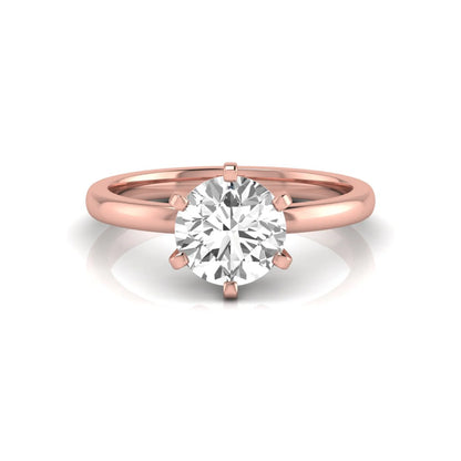 Round cut lab grown diamond solitaire engagement ring with six prong setting and rose gold metal tone.