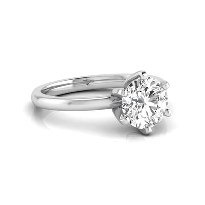Round cut lab grown diamond solitaire engagement ring with six prong setting and white gold metal tone.