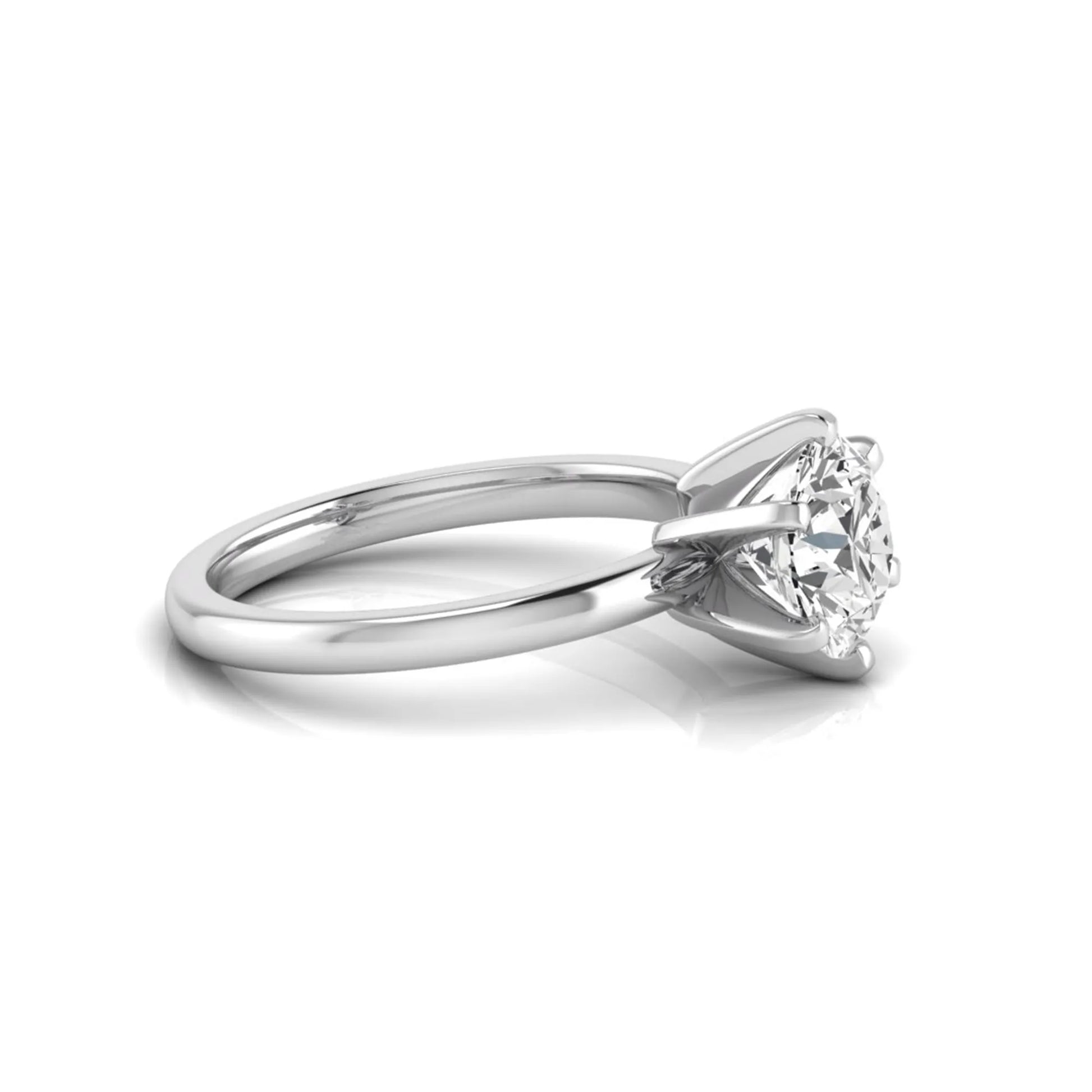 Round cut lab grown diamond solitaire engagement ring with six prong setting and white gold metal tone.