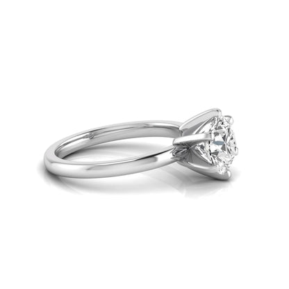 Round cut lab grown diamond solitaire engagement ring with six prong setting and white gold metal tone.