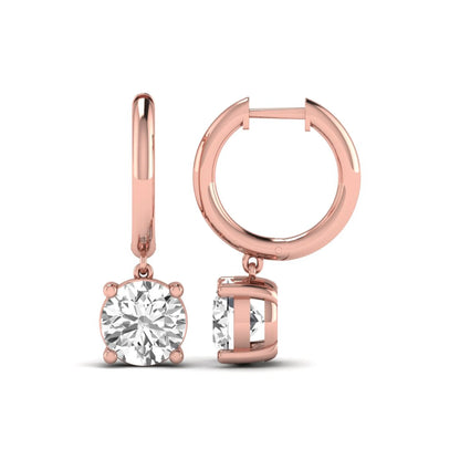 Round cut lab grown diamond solitaire huggie drop earrings featuring a four-prong basket setting, hinged snap closure, and rose gold tone design.