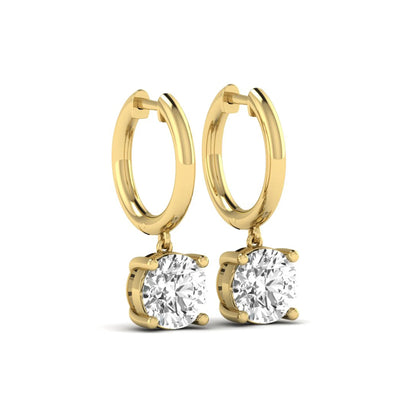 Round cut lab grown diamond solitaire huggie drop earrings featuring a four-prong basket setting, hinged snap closure, and yellow gold tone design.