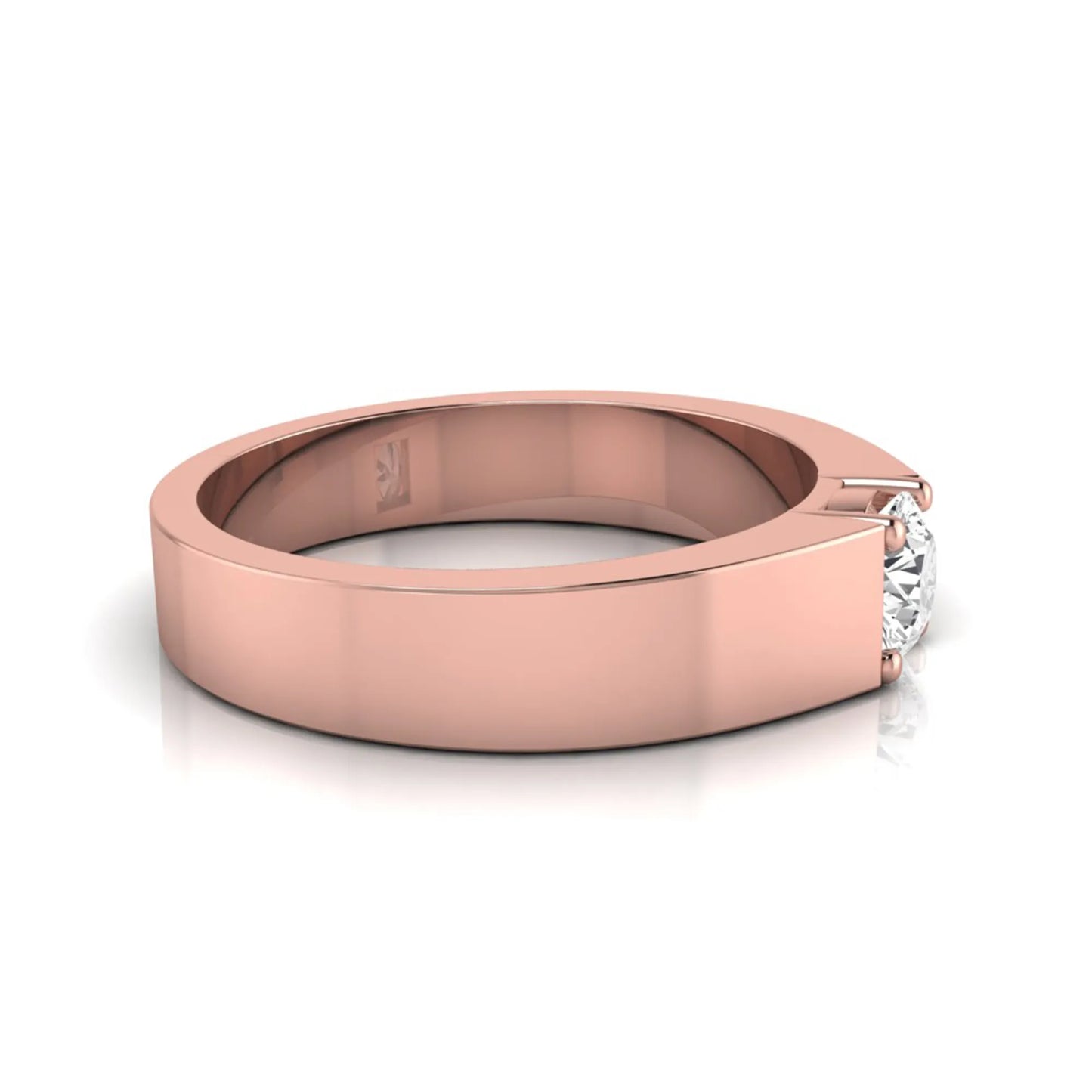 Round cut lab grown diamond solitaire ring featuring a modern flat polished band with a four-prong setting in rose gold tone.