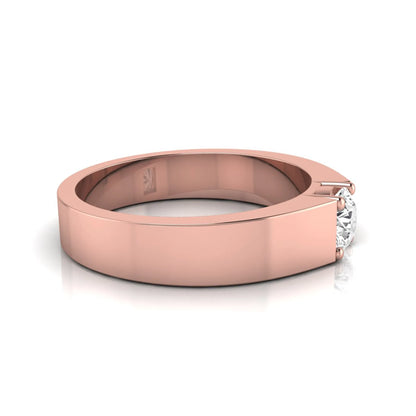 Round cut lab grown diamond solitaire ring featuring a modern flat polished band with a four-prong setting in rose gold tone.