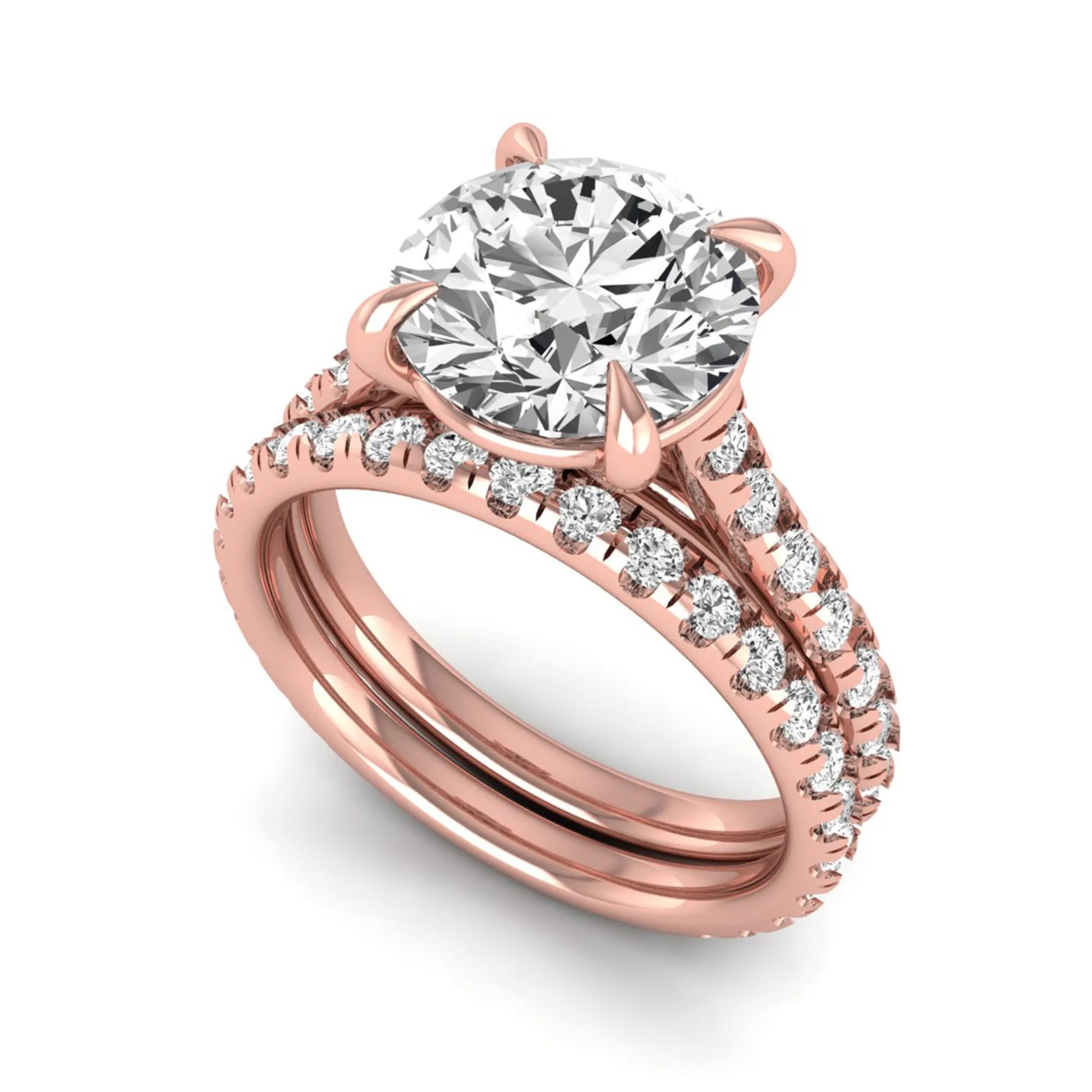 Round cut lab grown diamond bridal ring set featuring a four-prong solitaire center diamond with pavé-set engagement ring and matching pavé wedding band in a rose gold finish.