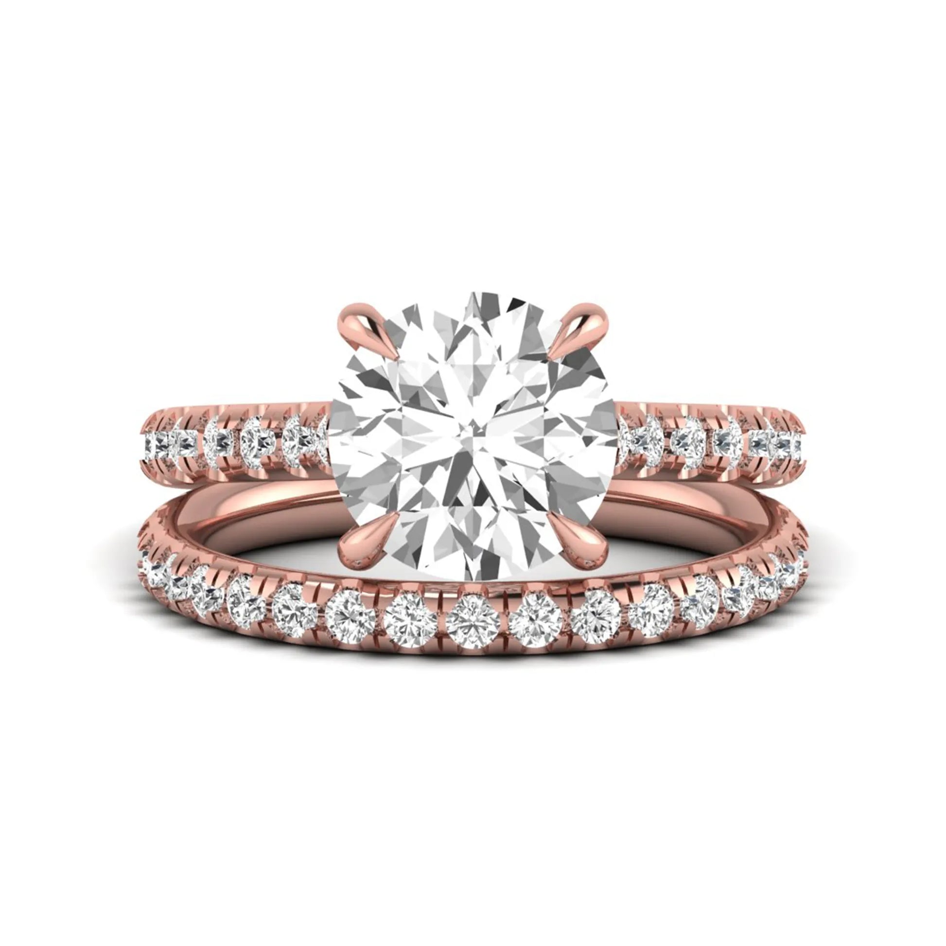 Round cut lab grown diamond bridal ring set featuring a four-prong solitaire center diamond with pavé-set engagement ring and matching pavé wedding band in a rose gold finish.