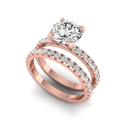Round cut lab grown diamond solitaire bridal ring set featuring pavé diamond bands in a rose gold tone design.