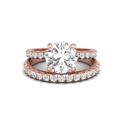 Round cut lab grown diamond solitaire bridal ring set featuring pavé diamond bands in a rose gold tone design.