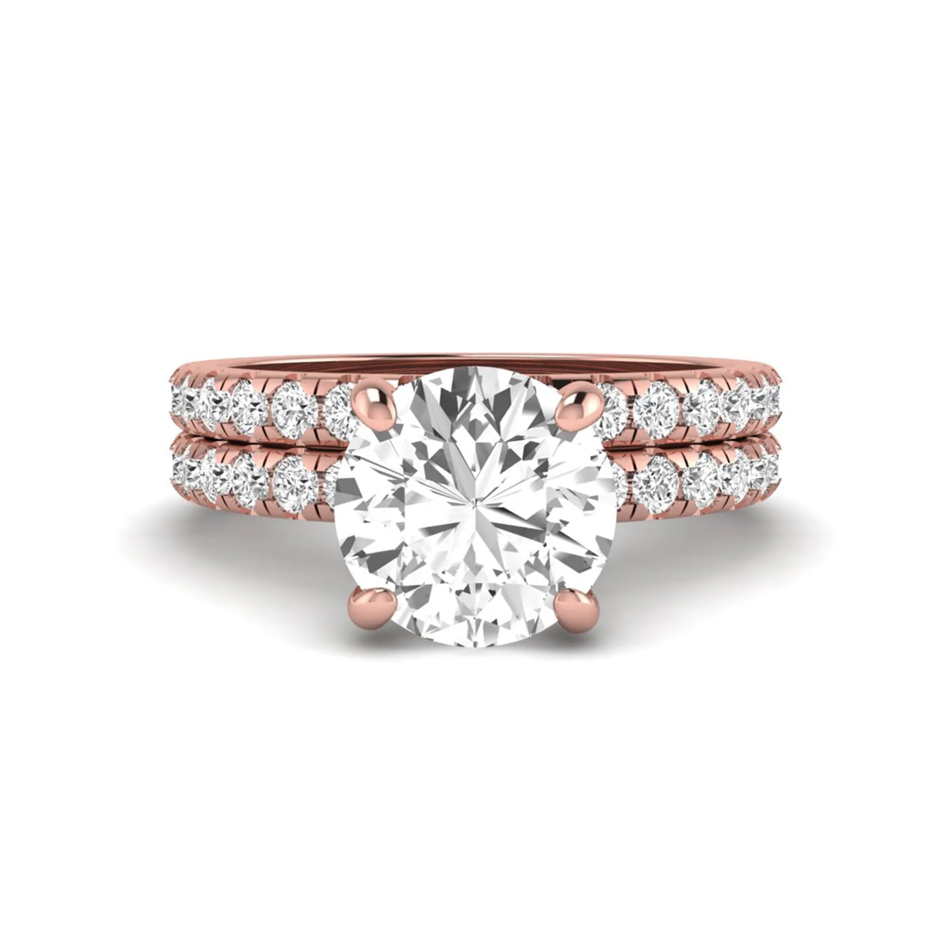 Round cut lab grown diamond solitaire bridal ring set featuring pavé diamond bands in a rose gold tone design.
