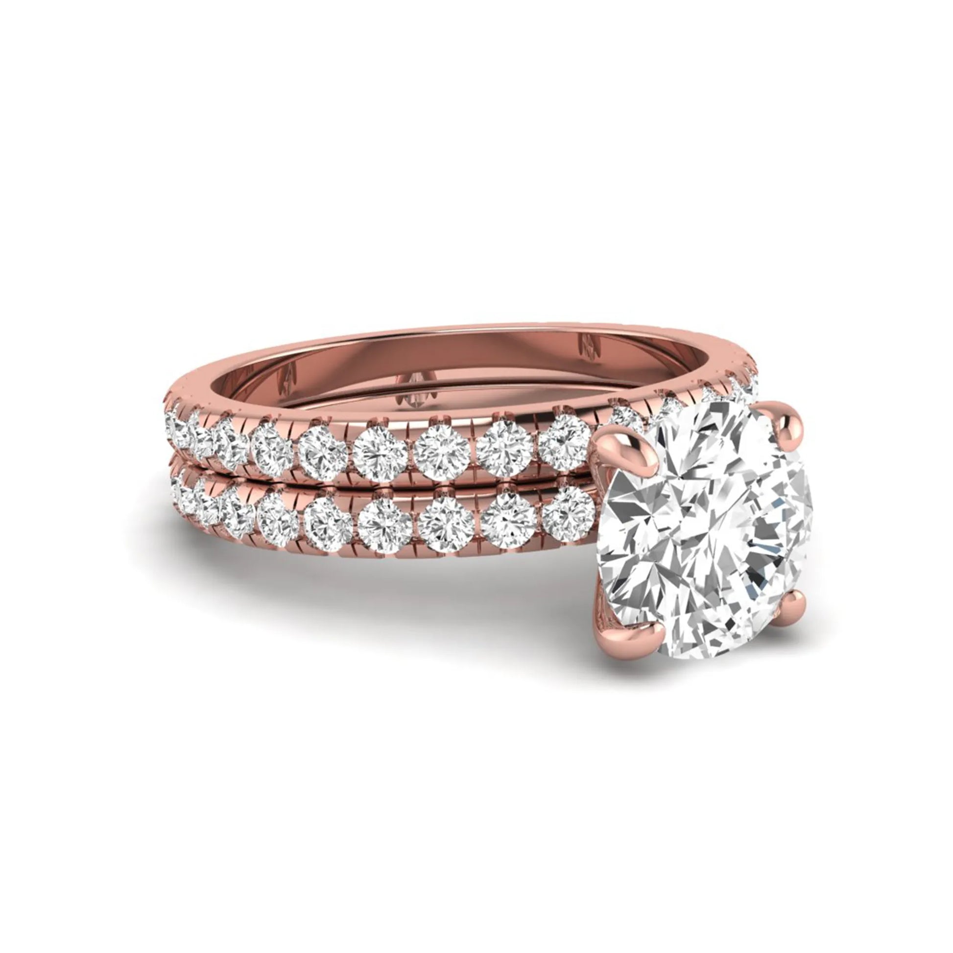 Round cut lab grown diamond solitaire bridal ring set featuring pavé diamond bands in a rose gold tone design.