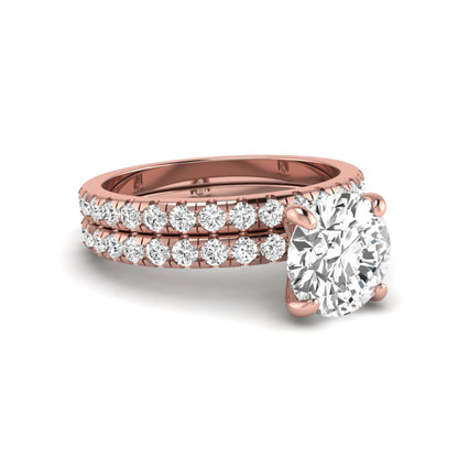 Round cut lab grown diamond solitaire bridal ring set featuring pavé diamond bands in a rose gold tone design.