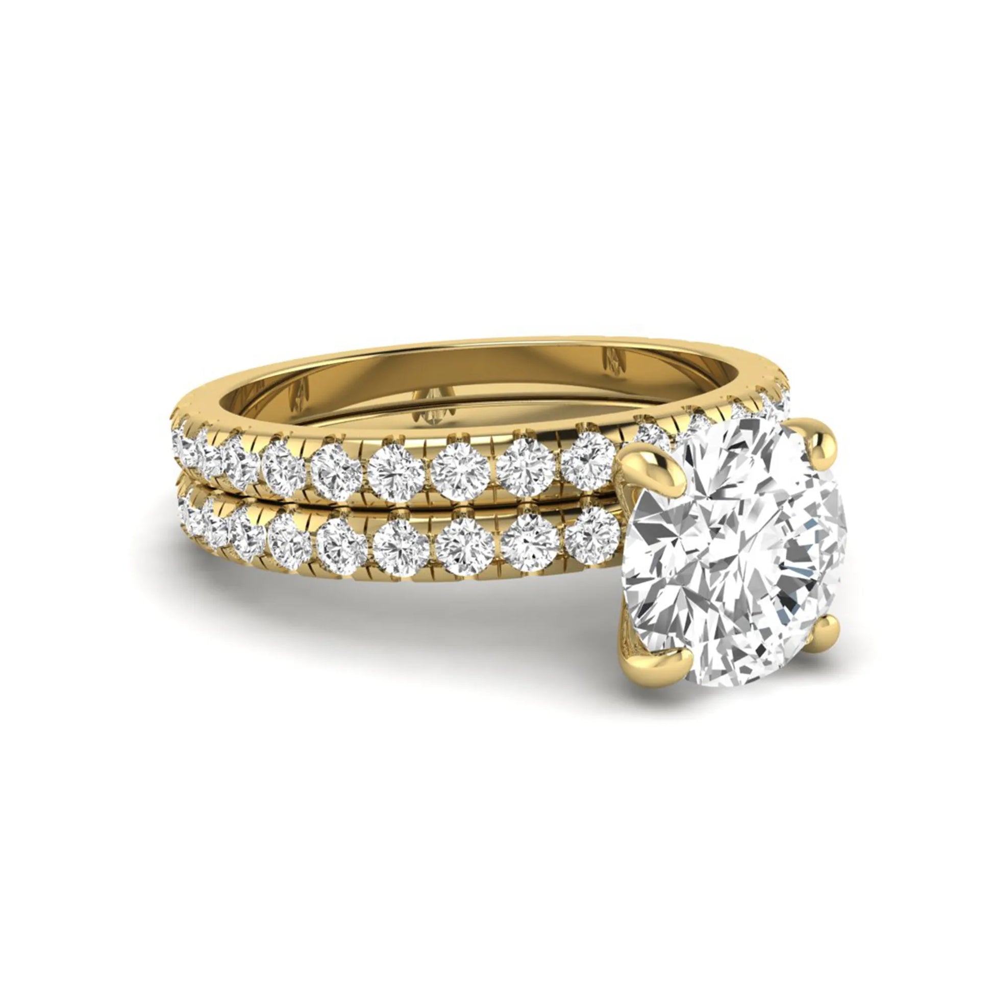 Round cut lab grown diamond solitaire bridal ring set featuring pavé diamond bands in a yellow gold tone design.