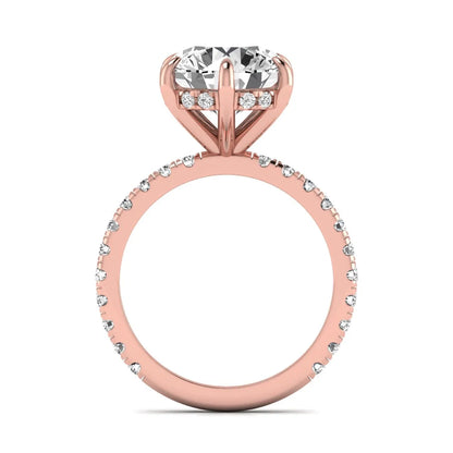 Round cut lab grown diamond solitaire engagement ring with pavé diamond band in rose gold design.