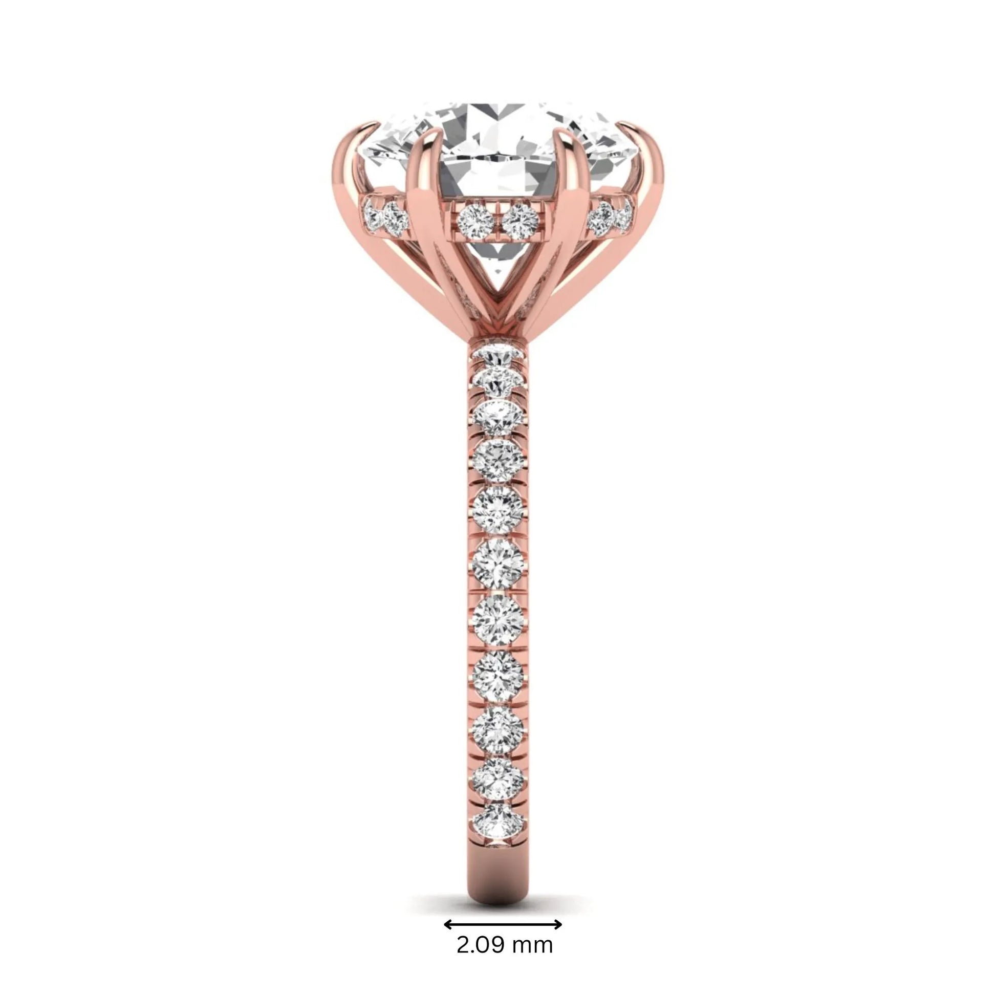 Round cut lab grown diamond solitaire engagement ring with pavé diamond band in rose gold design.