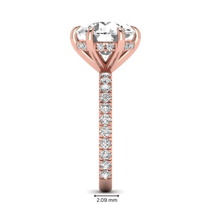 Round cut lab grown diamond solitaire engagement ring with pavé diamond band in rose gold design.