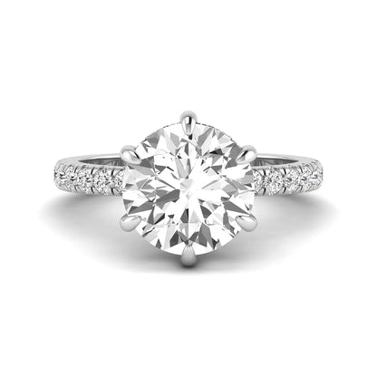 Round cut lab grown diamond solitaire engagement ring with pavé diamond band in white gold design.