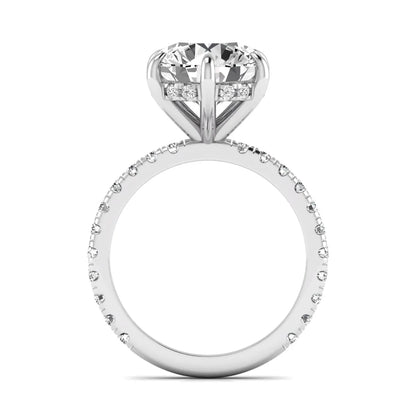 Round cut lab grown diamond solitaire engagement ring with pavé diamond band in white gold design.