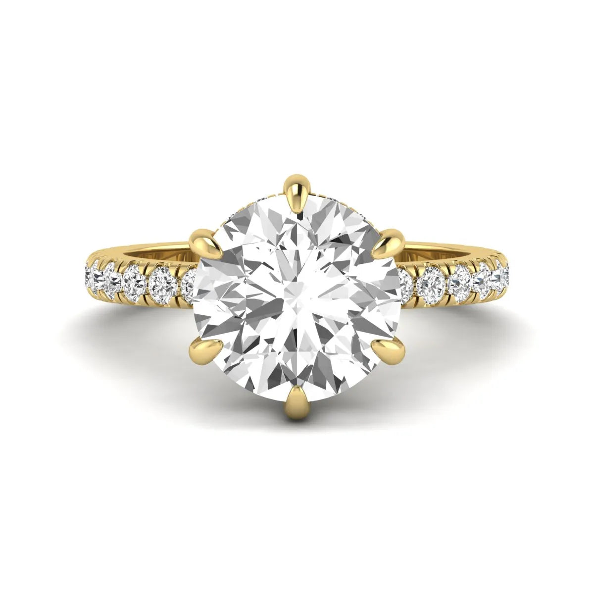 Round cut lab grown diamond solitaire engagement ring with pavé diamond band in yellow gold design.