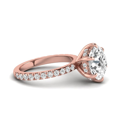 Round cut lab grown diamond solitaire engagement ring with pavé diamond band in rose gold design.
