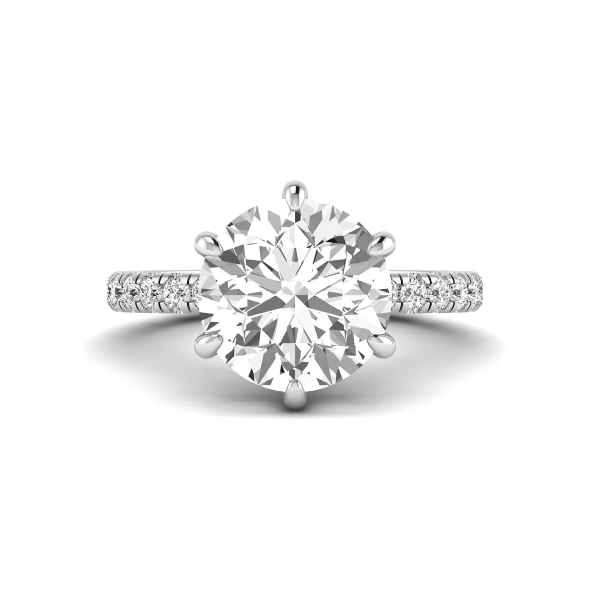 Round cut lab grown diamond solitaire engagement ring with pavé diamond band in white gold design.