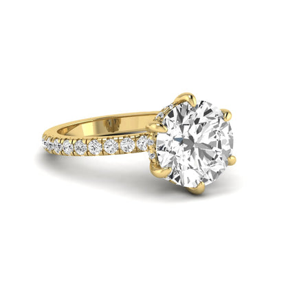 Round cut lab grown diamond solitaire engagement ring with pavé diamond band in yellow gold design.
