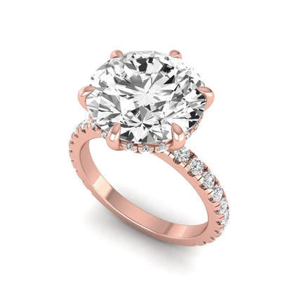 Round cut lab grown diamond solitaire engagement ring with pavé diamond band in rose gold design.
