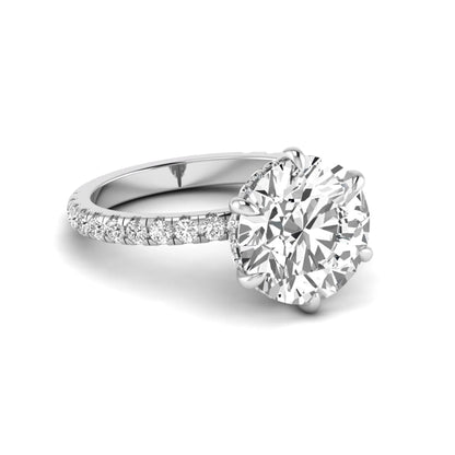 Round cut lab grown diamond solitaire engagement ring with pavé diamond band in white gold design.