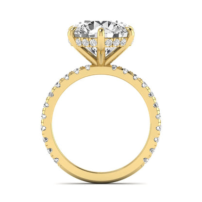 Round cut lab grown diamond solitaire engagement ring with pavé diamond band in yellow gold design.