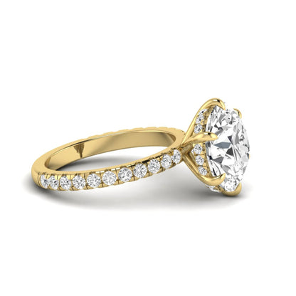 Round cut lab grown diamond solitaire engagement ring with pavé diamond band in yellow gold design.
