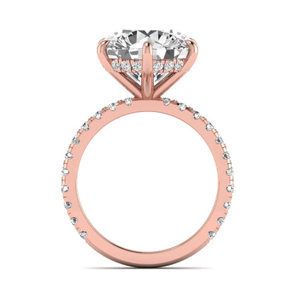 Round cut lab grown diamond solitaire engagement ring with pavé diamond band in rose gold design.