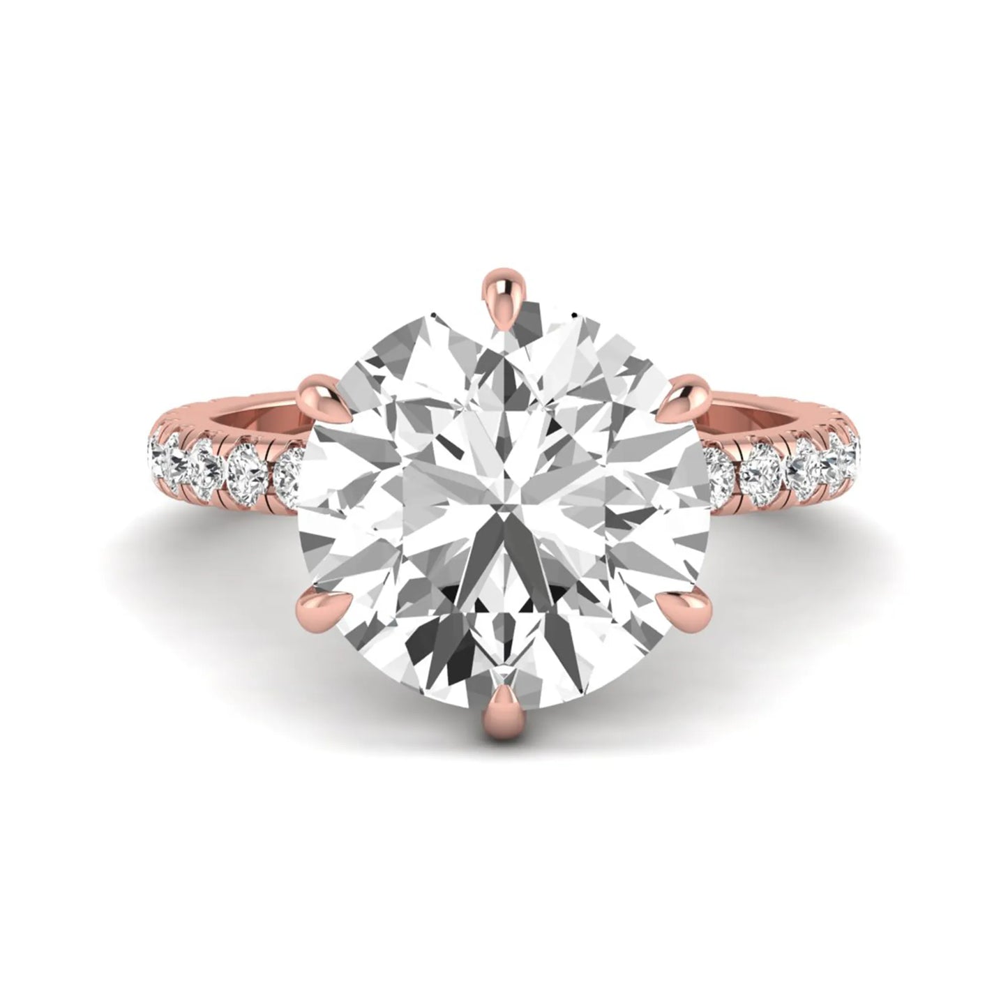 Round cut lab grown diamond solitaire engagement ring with pavé diamond band in rose gold design.