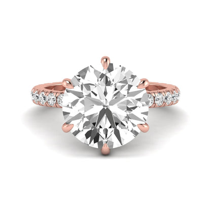 Round cut lab grown diamond solitaire engagement ring with pavé diamond band in rose gold design.
