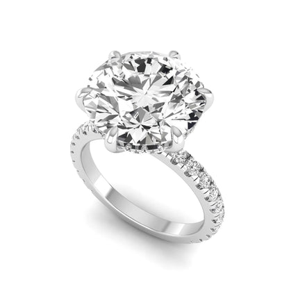 Round cut lab grown diamond solitaire engagement ring with pavé diamond band in white gold design.