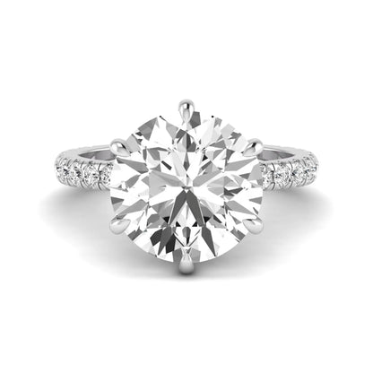 Round cut lab grown diamond solitaire engagement ring with pavé diamond band in white gold design.