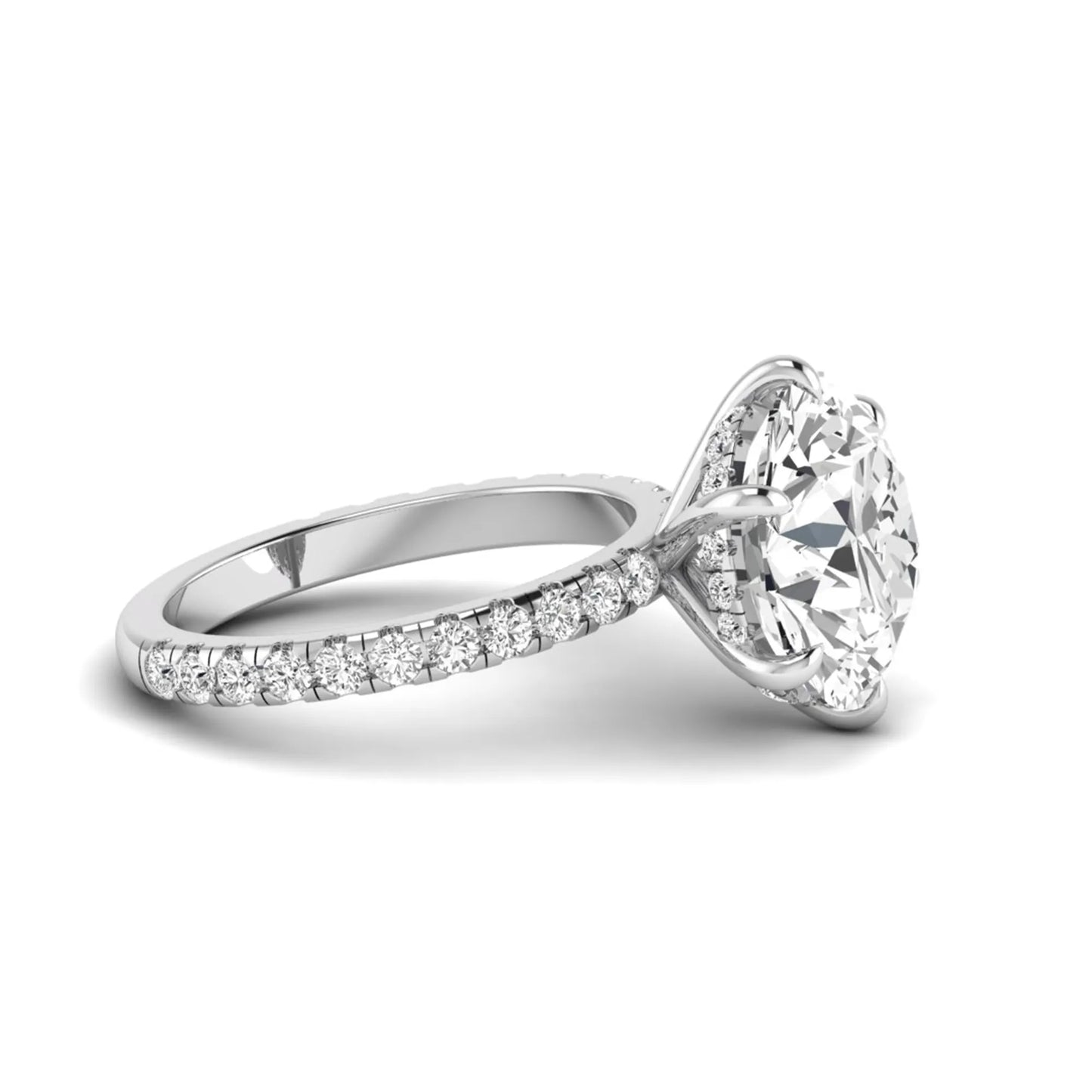 Round cut lab grown diamond solitaire engagement ring with pavé diamond band in white gold design.