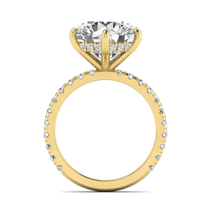 Round cut lab grown diamond solitaire engagement ring with pavé diamond band in yellow gold design.