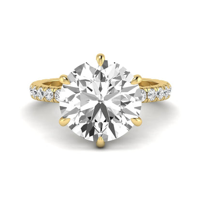Round cut lab grown diamond solitaire engagement ring with pavé diamond band in yellow gold design.