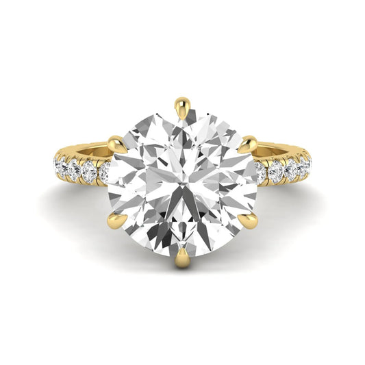 Round cut lab grown diamond solitaire engagement ring with pavé diamond band in yellow gold design.