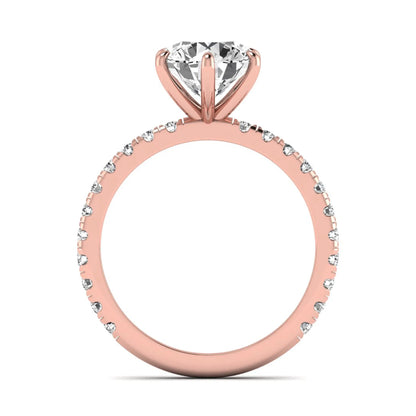 Round cut lab grown diamond solitaire engagement ring with pavé band in rose gold design.