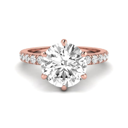 Round cut lab grown diamond solitaire engagement ring with pavé band in rose gold design.